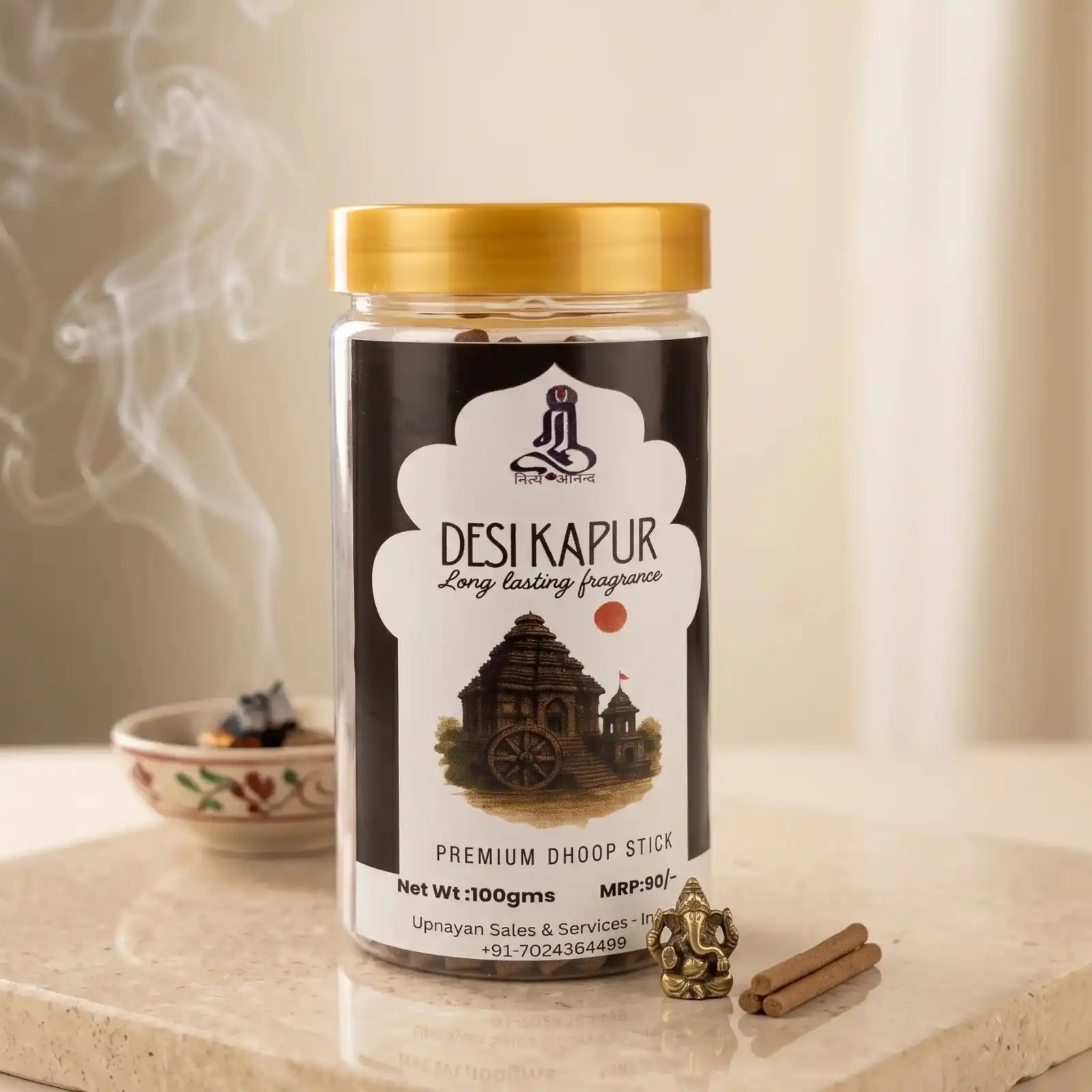GURU Desi Kapur Dhoop Stick jar on a marble slab with a small brass Ganesha statue