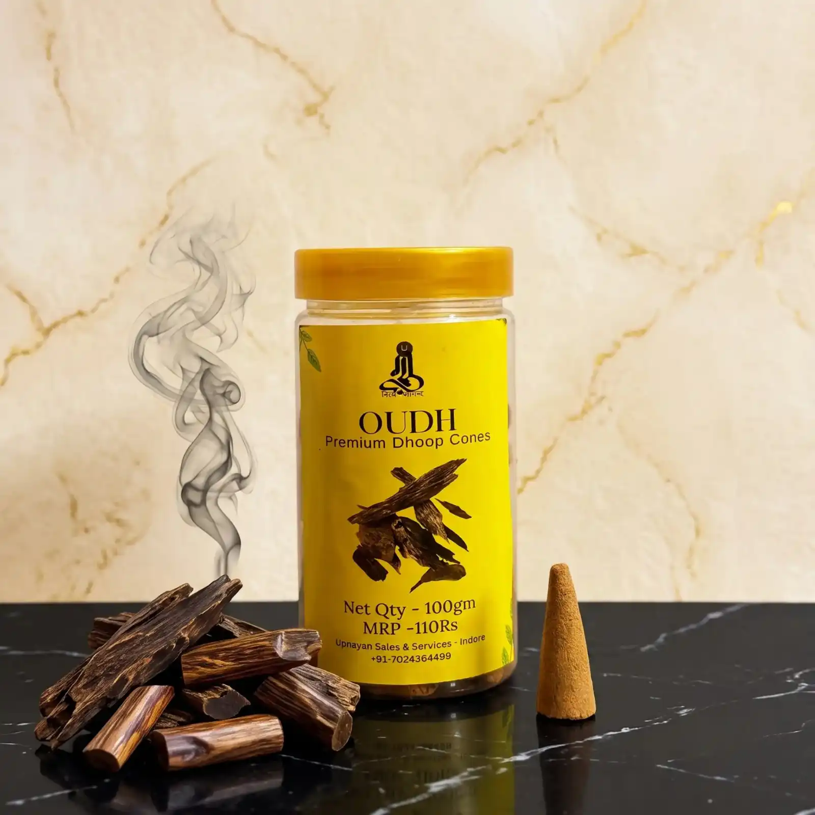 GURU Oudh Premium Dhoop Cones yellow jar on black marble with agarwood logs and smoking cone
