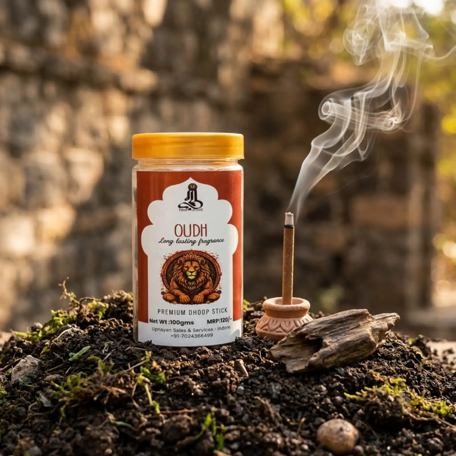 GURU Oudh Premium Dhoop Stick jar with lit dhoop in a clay burner