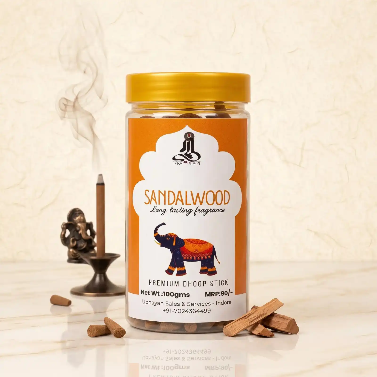 GURU Sandalwood Dhoop Stick jar with elephant illustration, unlit cones, and sandalwood logs